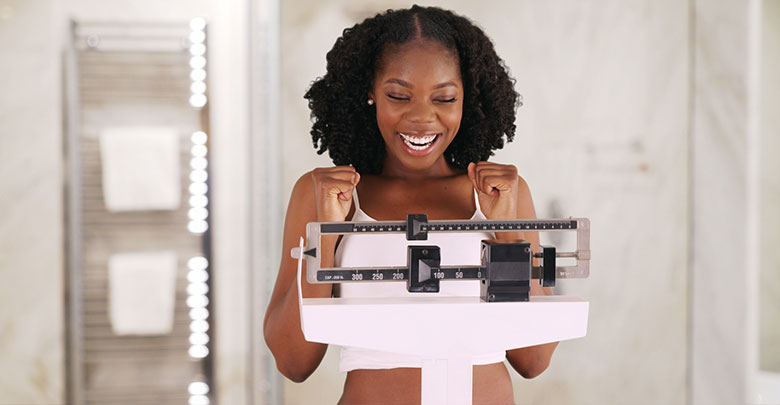 Lose weight to help prevent knee injury. This runner  is delighted with her weight on the scale